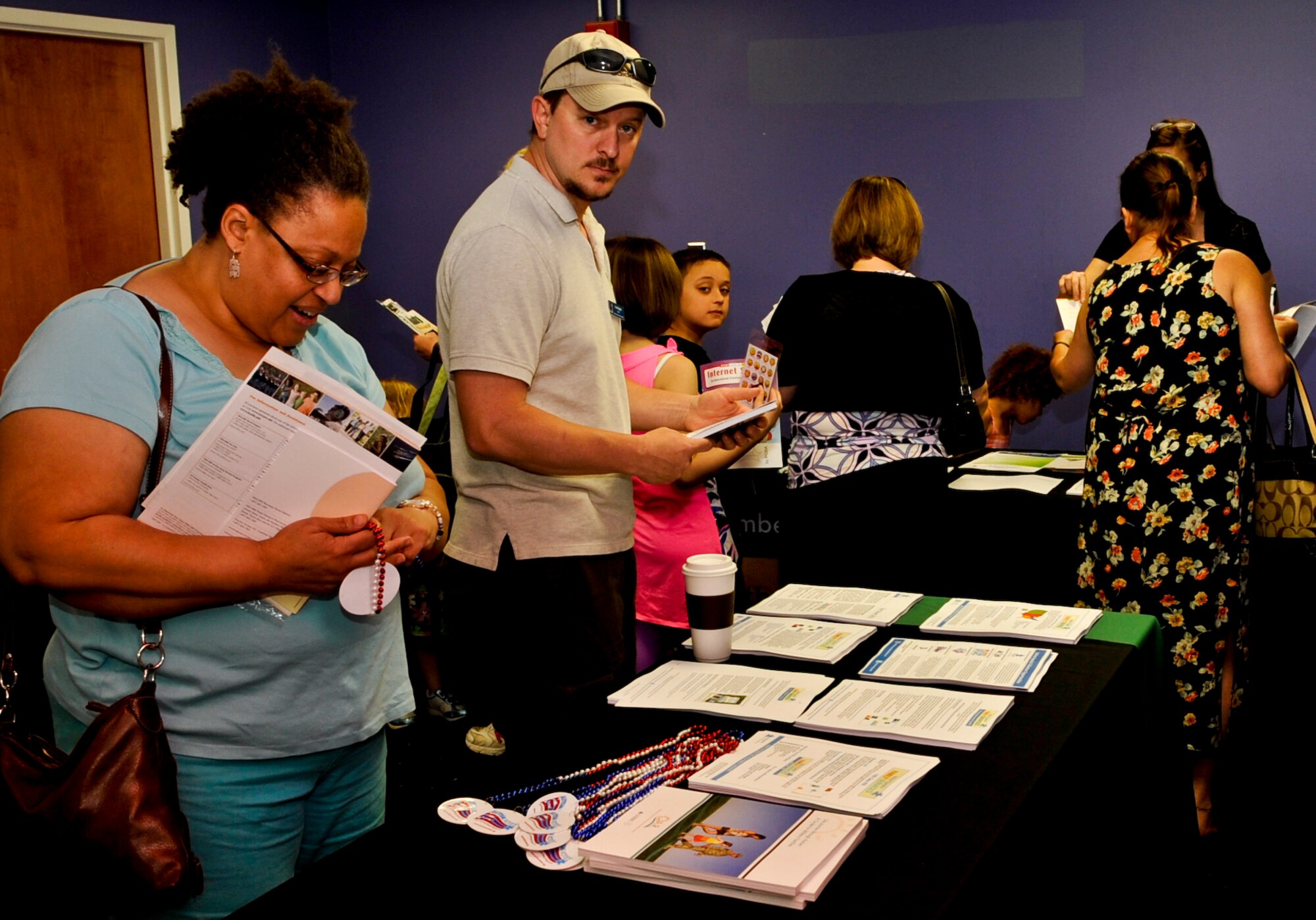 Individuals from Joint Base Langley-Eustis attend an Autism awareness information fair inside the Jacobs Theater at Fort Eustis, Va., April, 11, 2013. Guests attending were also briefed by Karen Driscoll, Autism Speaks associate director for federal government relations and military affairs. (U.S. Air Force photo by Staff Sgt. Wesley Farnsworth/Released)