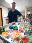 U.S. Air Force Tech. Sgt. Matt Fitzgerald, 23d Aerospace Medicine Squadron dental laboratory NCO in charge, opens a drawer full of training projects at Moody Air Force Base, Ga., April 9, 2013. The dental laboratory is responsible for making dental prosthetics and appliances, such as retainers, crowns and mouth guards for the base. (U.S. Air Force photo by Senior Airman Jarrod Grammel/Released)