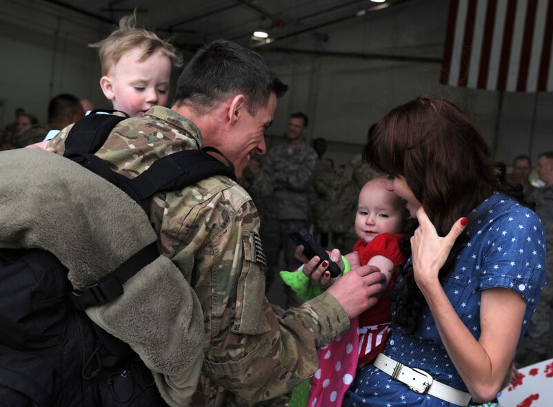 Air Commandos returning from deployment were welcomed home by 27th Special Operations Wing leadership, family members and friends during Operation Homecoming at Cannon Air Force Base, N.M., April 9, 2013. Operation Homecoming is a monthly event that reunites Cannon's Air Commandos with their loved ones. (U.S. Air Force photo/Airman 1st Class Ericka Engblom)
