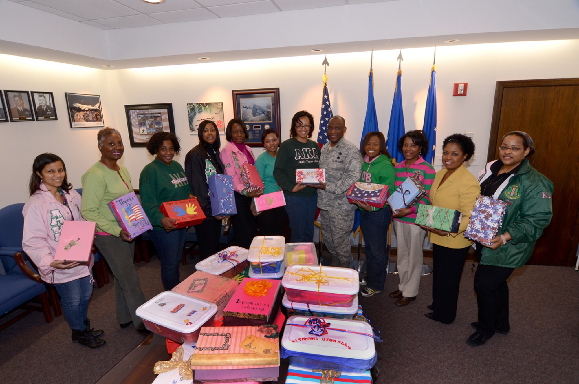 Col. Marshall Irvin, 94th Mission Support Group commander, and
Angela Pedersen, director of Airmen and Family Readiness, accept
donated toiletries from members of Alpha Kappa Alpha Sorority, Inc.
March 2. The toiletries will be used during the Wing Care Package
Day April 20. (photo by Brad Fallin)