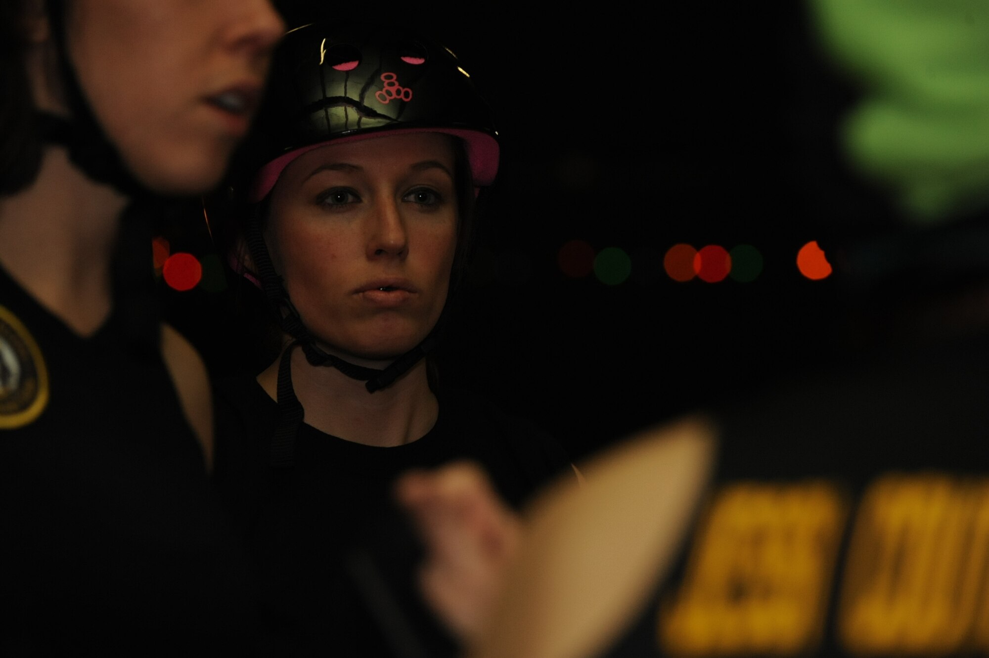Staff Sgt. Amanda Chelchowski, the 19th Airlift Wing command chief executive, concentrates on instructions given from the team captain Feb. 26, at the Conway Roller Rink in Conway, Ark. This is Chelchowski’s first season with the BreakNeck Brawlers. (U.S. Air Force photo by Airman 1st Class Kaylee Clark))