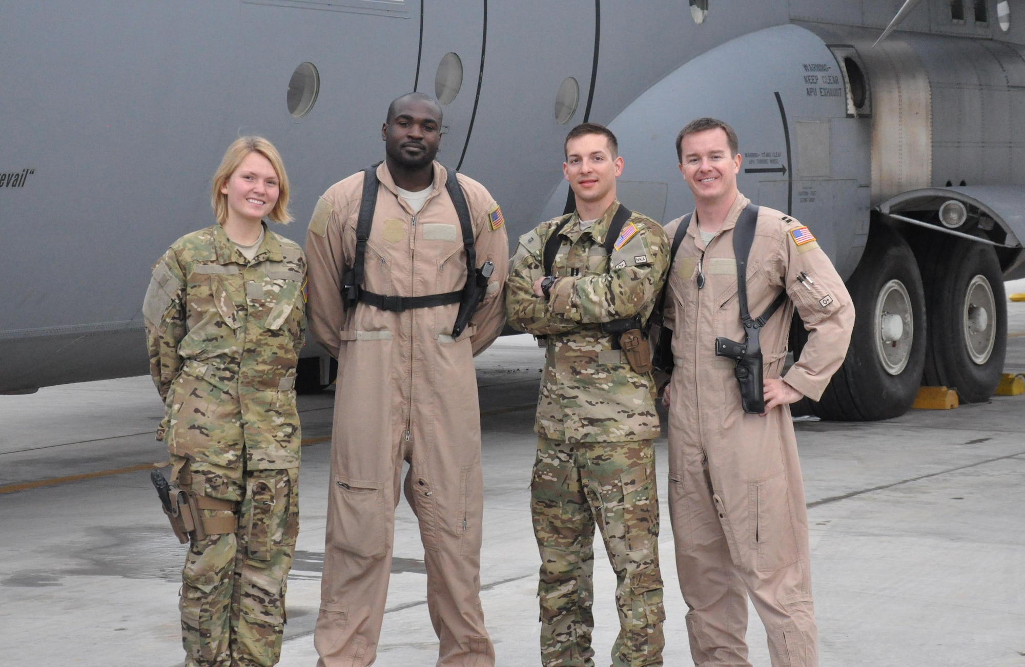Airman 1st Class Anastasia McCorkle and Tech. Sgt. Brian Commodore, C-130J loadmasters, Capt. Eric Jones, co-pilot, and Capt. Ryan Thornton, the aircraft commander, were the crew of the C-130J Aeromedical Evacuation mission on March 28, 2013, that evacuated a critically wounded combat controller from Mazar-e Sharif to Bagram Airfield, Afghanistan. The crew, with the 772nd Expeditionary Airlift Squadron at Kandahar Airfield, is deployed from Little Rock Air Force Base, Ark. (U.S. Air Force photo/Capt. Tristan Hinderliter)