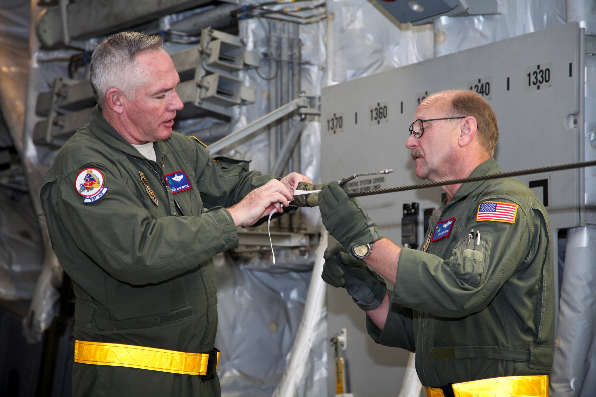 Master Sgt. Jack Smythe (left) and Master Sgt. Dennis Moore, loadmasters with the 701st Airlift Squadron here at Joint Base Charleston, S.C., prepare a static line during pre-flight in preparation for a training mission today. The mission, named Exercise Furious Moose, was a joint total-force effort between JB Charleston’s active duty airmen of 437th Airlift Wing and the Reserve airmen of the 315th Airlift Wing, which included completing a variety of mission readiness training objectives for aircrews, maintenance and support crews. (U.S. Air Force photo by Staff Sgt. Rashard Coaxum/released)