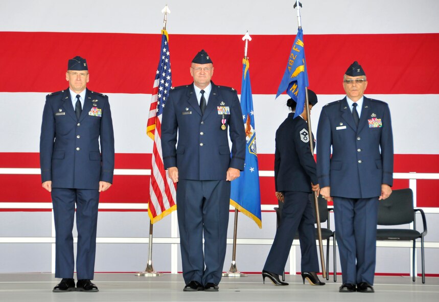 From left: Col. Donald Lindberg, 482nd Fighter Wing commander, Col. Douglas Batson, new 482nd Maintenance Group commander, and Col. Gerald Micheletti, previous 482nd MXG commander, stand at attention during a change of command ceremony at Homestead Air Reserve Base, Fla., April 7. (U.S. Air Force photo/Senior Airman Nicholas Caceres)