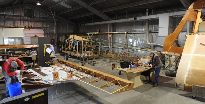 Waco glider restoration project volunteers work on a variety of parts at Whiteman Air Force Base, Mo., April 2, 2013. Whiteman was originally named Sedalia Army Air Field and was originally used as a training base for Waco glider pilots. (U.S. Air Force photo by Airman 1st Class Bryan Crane/Released)