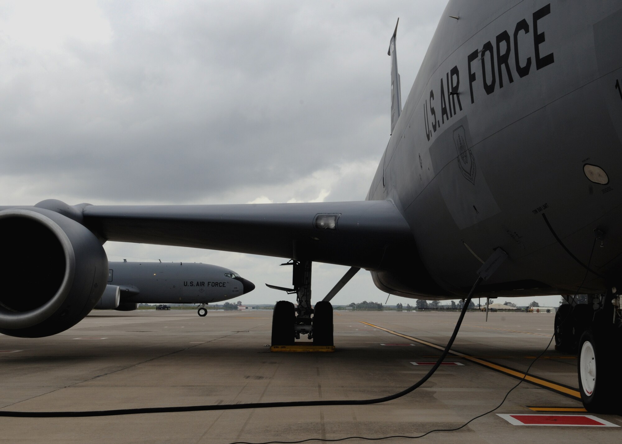 A KC-135 Stratotanker taxis after returning from a refueling mission while another prepares to launch April 9, 2013, in Southwest Europe. Both aircraft are operated by the 351st Expeditionary Air Refueling Squadron and fly air-to-air refueling missions supporting the French in Mali. (U.S. Air Force photo by 1st Lt. Christopher Mesnard/Released)
