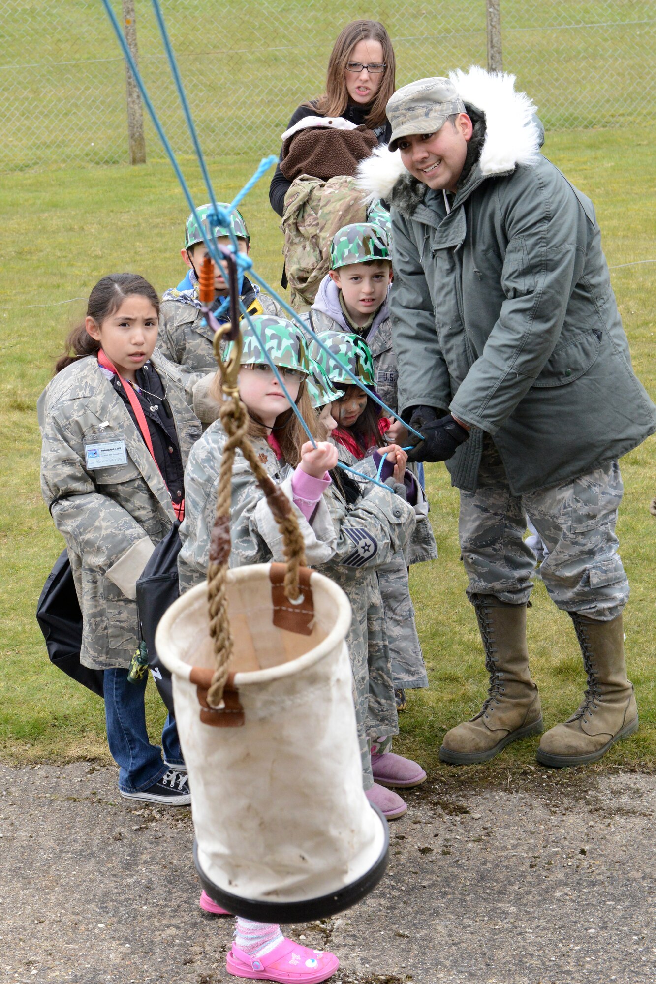 RAF CROUGHTON, United Kingdom - The 422nd Air Base Squadron Airman & Family Readiness Center held Camp Kudos throughout RAF Croughton April 4. The first of six groups started "out-processing" at 11 a.m. They were escorted from the out processing area to hands-on active events by the track and A-Frames. The typical out-processing events inside the Community Center included collecting dog tag and a mobility bag from CSS, getting a travel card from finance, powers of attorney to care for their pets from the legal assistance office, camo face paint, and a few other tables before the hands-on fun outside. (U.S. Air Force photo by Tech. Sgt. Chrissy Best)