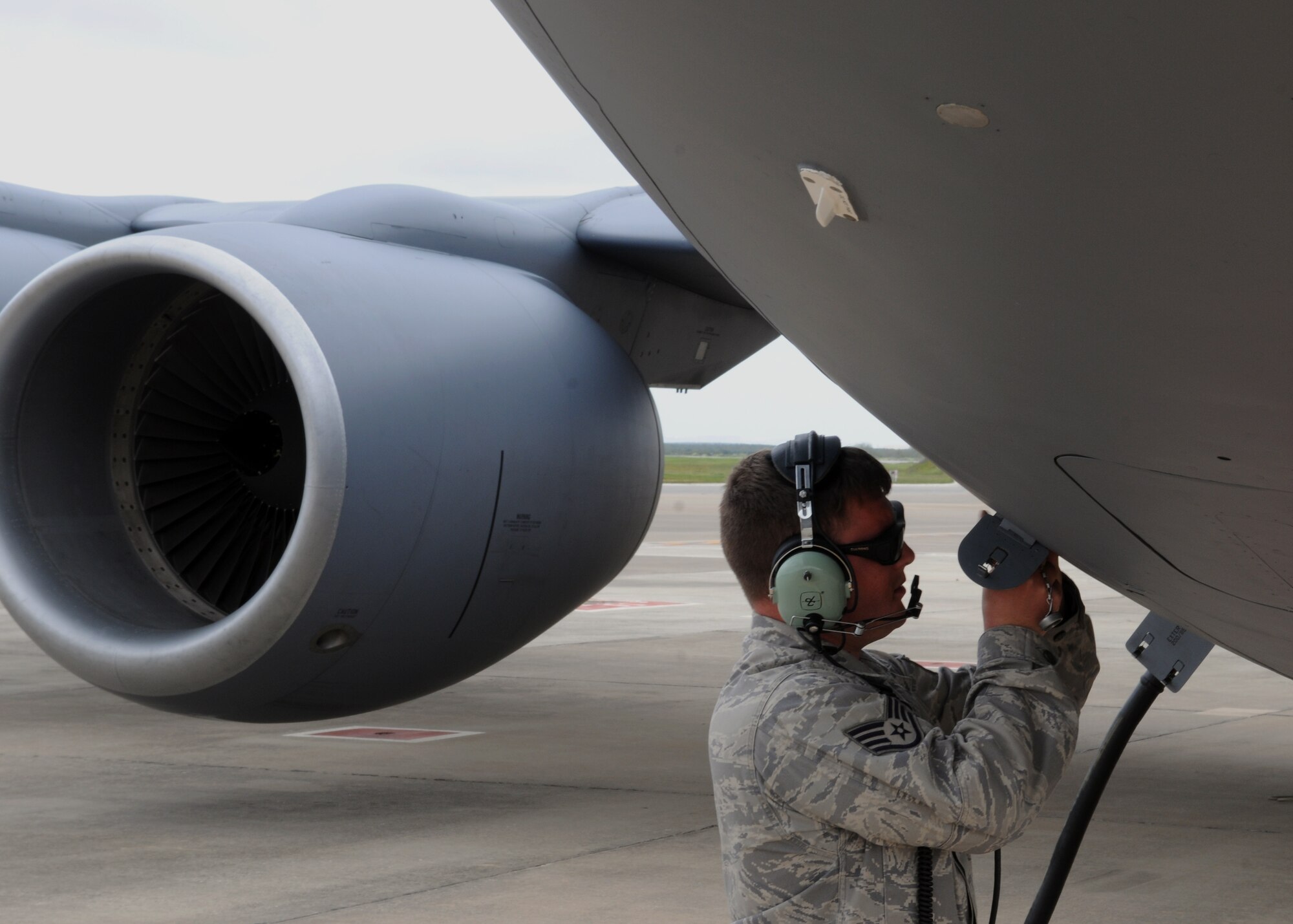 Staff Sgt. Joshua Bussiere, 351st Expeditionary Air Refueling Squadron, Guidance Control specialist, makes the final exterior preparations to a KC-135 Stratotanker April 9, 2013, in Southwest Europe, prior to its launch. Bussiere, from Jaffrey, N.H., augments the crew chiefs on the ground and assists in the take-off and recovery of the refueling aircraft.  (U.S. Air Force photo by 1st Lt. Christopher Mesnard/Released)
