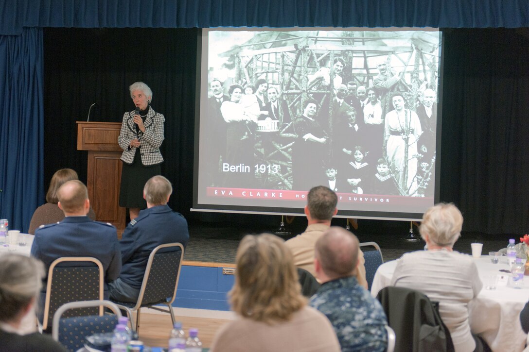 RAF ALCONBURY, United Kingdom – Eva Clarke, the daughter of a Czech mother and German father, both of whom were Jewish, spoke at the Holocaust Remembrance Luncheon at the RAF Alconbury Community Activities Center April 8. She shared her parents’ experiences of being kept prisoner for three years in German concentration camps, saying her parents weren’t her only family members suffering at the hands of the Nazi soldiers, 15 members of her family were in concentration camps. (U.S. Air Force photo by Staff Sgt. Brian Stives)