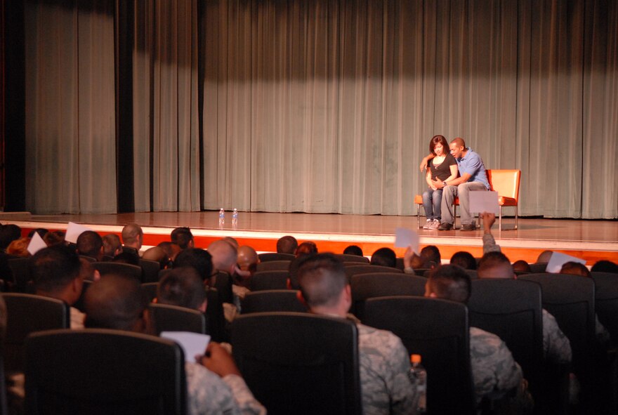 Derante Parker and Kristen Pickering, actor educators of the Catharsis Productions' "Sex Signals" presentation, perform during the presentation at the Keystone Theater on Kadena Air Base, Japan, April 8, 2013. The show highlights dating situations and brings awareness to the reality of sexual assault with wit, humor, and straight talking. The ever-evolving skit currently has a company of 24 actors that travel by pairs around the world to military bases and was hosted on Kadena as part of Sexual Assault Awareness Month. (U.S. Air Force photo by Staff Sgt. Lauren Snyder/Released)