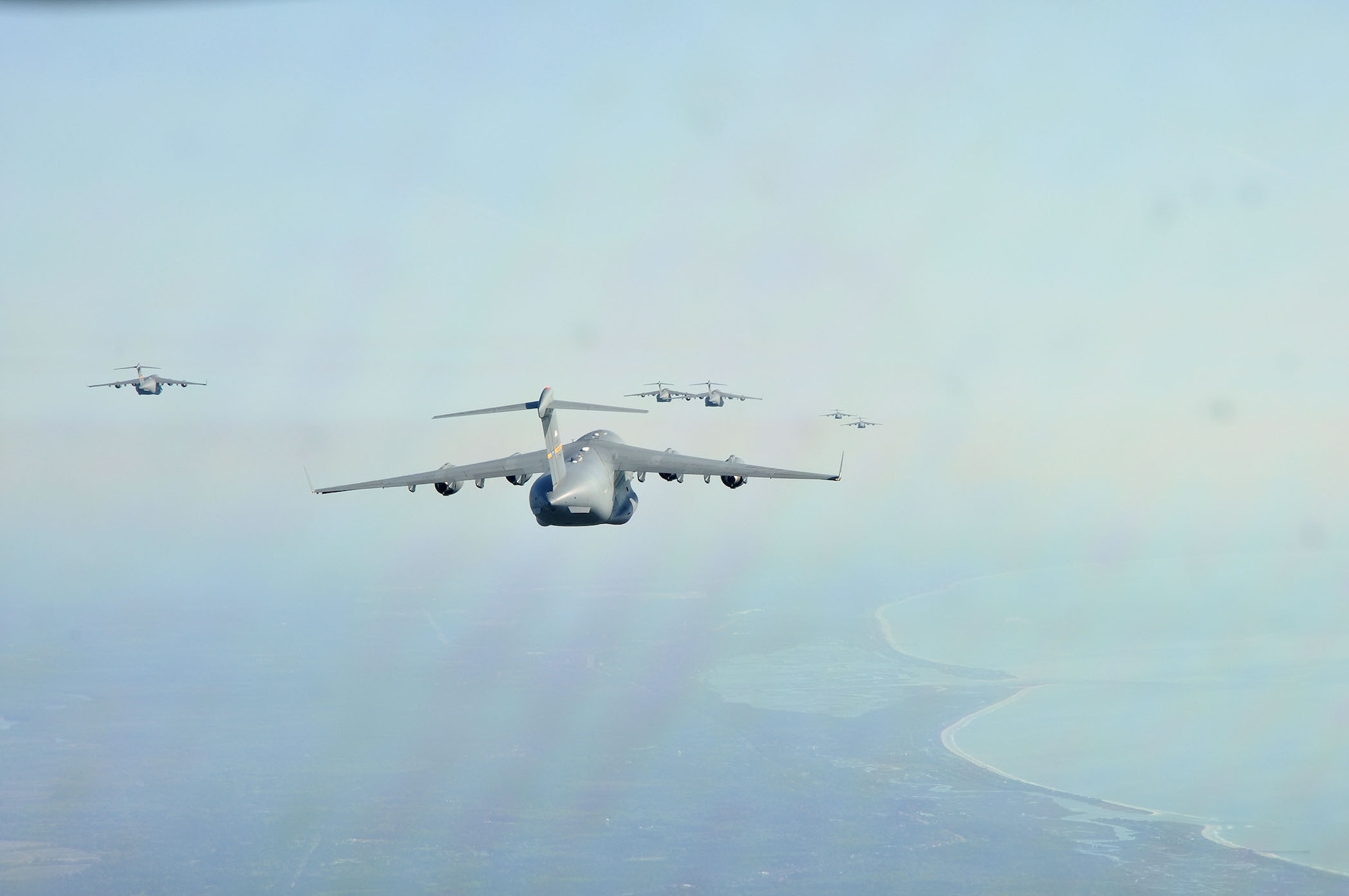 Aircrews from the 437th and 315th Airlift Wings at Joint Base Charleston conducted a large formation exercise (LFE) consisting of 13 C-17 Globemaster III aircraft Wednesday, April 9, 2013.  The mission included a variety of training exercises consisting of airdrops, aerial refueling and low level tactical training. These skills are needed at all times to ensure mission readiness, locally and globally. (U.S. Air Force photo/Senior Airman Bobby Pilch)