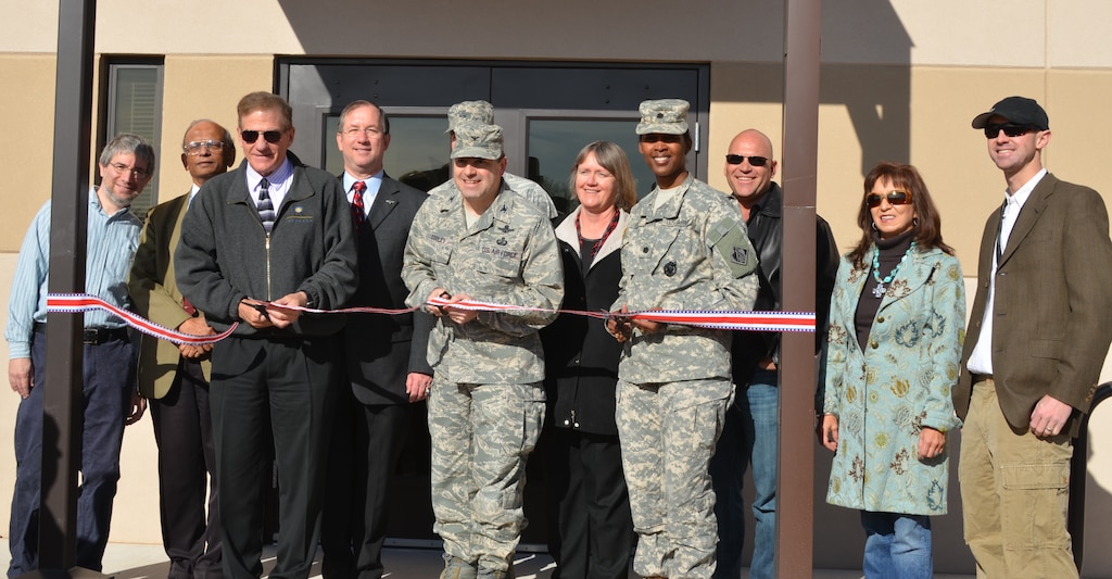 (L-R) Mayer Landau, scientist, Space Vehicles Directorate; B.K. “Babu” Singaraju, division chief, Space Vehicles Directorate; Dr. Jim Riker, chief scientist, Space Vehicles Directorate; Brent Wilson, base civil engineer; Capt. Dustin Guidry, deputy branch chief, Space Vehicles Directorate; Col. Bill Cooley, materiel wing director, Space Vehicles Directorate; Susan Atwood, deputy director, Space Vehicles Directorate; Lt. Col. Gant, commander, U.S. Army Corps of Engineers, Albuquerque District; Mike Granjean, vice president, GranCor Enterprises, Inc.; Maria Cornay, president, GranCor Enterprises, Inc.; Dr. Vincent Cowan, scientist, Space Vehicles Directorate, participate in officially opening the Space Sensors Laboratory at Kirtland Air Force Base. 

