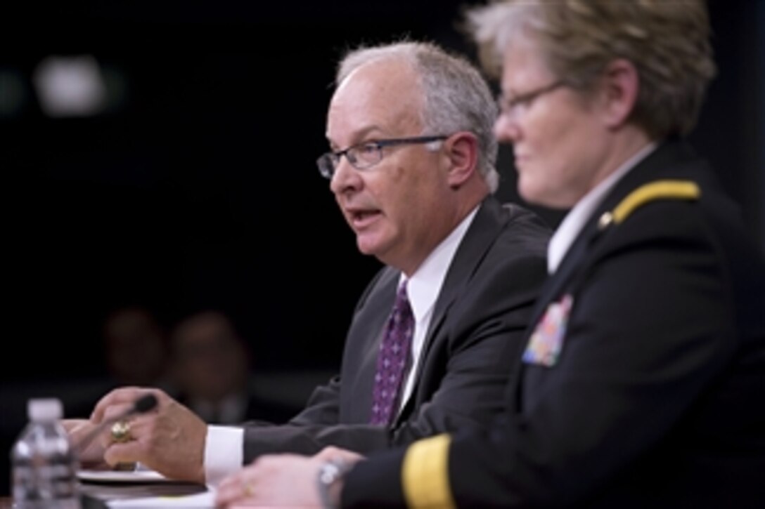 Deputy Director of Army Budget Davis Welch, left, and Director of Army Budget Maj. Gen. Karen Dyson brief the press on the Army portion of President Obama's budget request for the 2014 fiscal year in the Pentagon on April 10, 2013.  