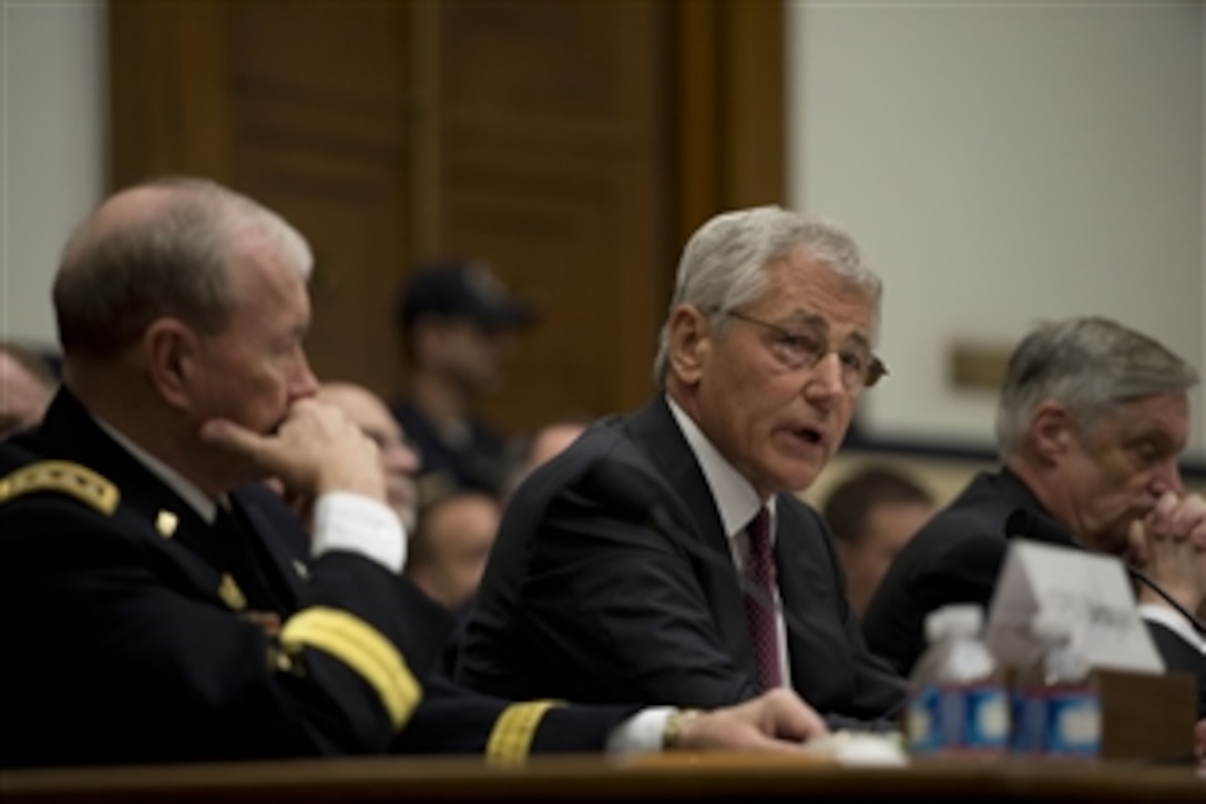 Secretary of Defense Chuck Hagel testifies before the House Armed Services Committee on the fiscal year 2014 National Defense Authorization Budget Request at the Rayburn House Office Building in Washington, D.C., on April 11, 2013.  Chairman of the Joint Chiefs of Staff Gen. Martin E. Dempsey and Under Secretary of Defense-Comptroller Robert Hale joined Hagel for the testimony.  