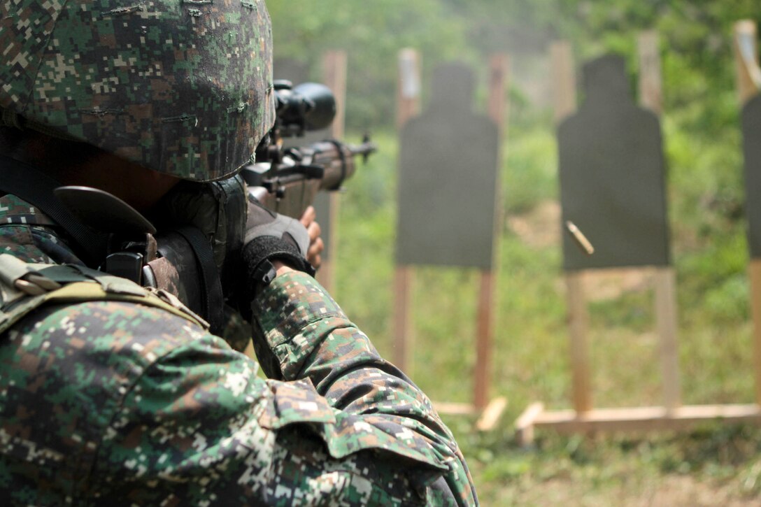 A Philippine Marine fires his M-14 rifle at a target during a combat marksmanship program shoot as part of exercise Balikatan 2013 here, April 8. Marines and Sailors from Company B., Battalion Landing Team 1st Battalion, 5th Marines, 31st Marine Expeditionary Unit, and Philippine Marines fired side by side, improving their interoperability with one another. Balikatan 2013 helps maintain a high level of interoperability and enhances military-to-military relations and combined combat capabilities. The 31st MEU is the only continuously forward-deployed MEU and is the Marine Corps’ force in readiness in the Asia-Pacific region.