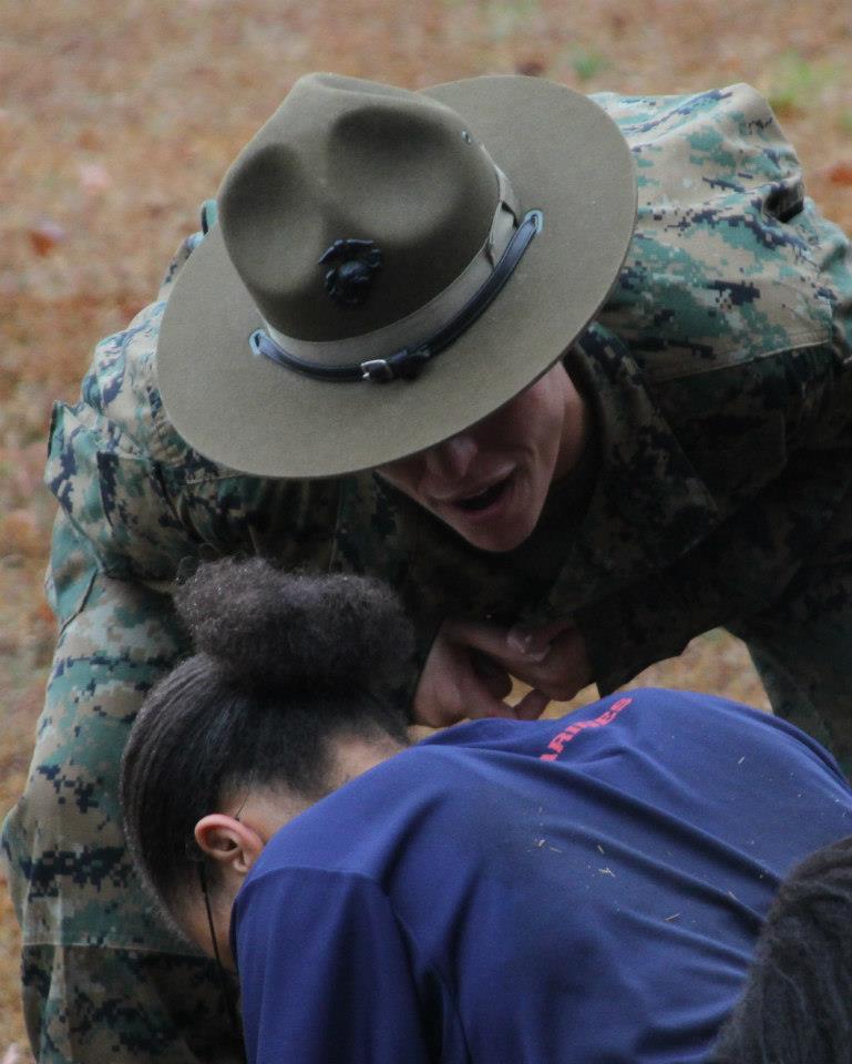 A drill instructor from Marine Corps Recruit Depot Parris Island, S.C. motivates a female enlistee during the annual Recruiting Station Columbia Female Pool Function on Feb. 23 in Fort Jackson, S.C. Drill instructors attended the event to help enlistees understand the rigors of recruit training. (Marine Corps Photo by Sgt. Aaron Rooks)