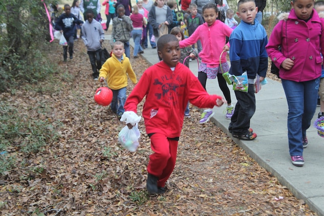 Chidren run and look for eggs during the Easter egg hunt held at the Laurel Bay Youth Center, March 23. The Eggstravaganza was the first event to bring all units within the tri-command together for one unified Easter celebration. 