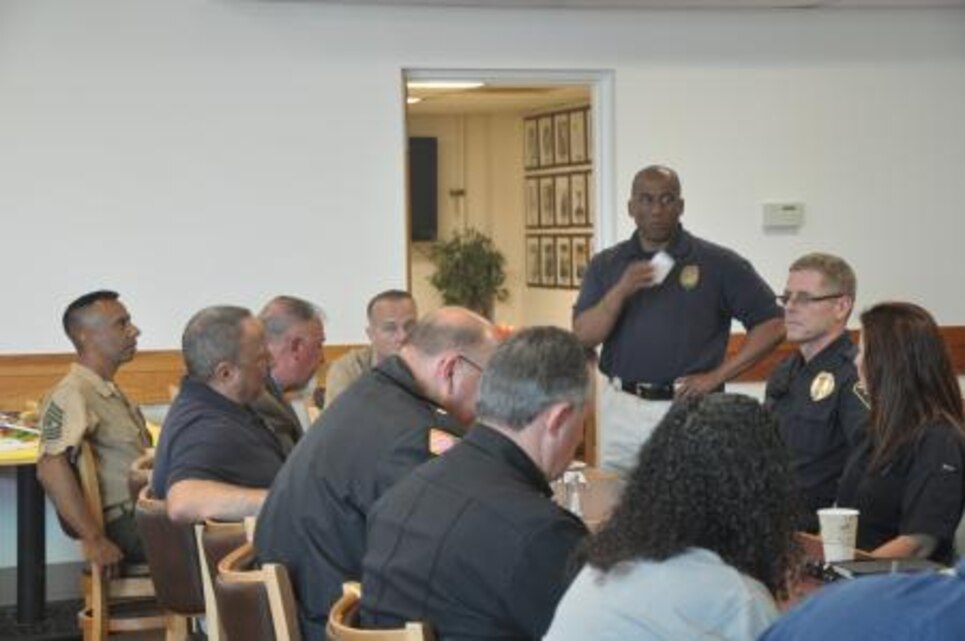 Chief Darwin O’Neal with Marine Corps Police Department on Marine Corps Logistics Base Barstow, Calif., speaks about the base’s upcoming events to the rest of the agencies, April 5. The meet and greet happens once a month, allowing each agency to share their schedules and exchange ideas.