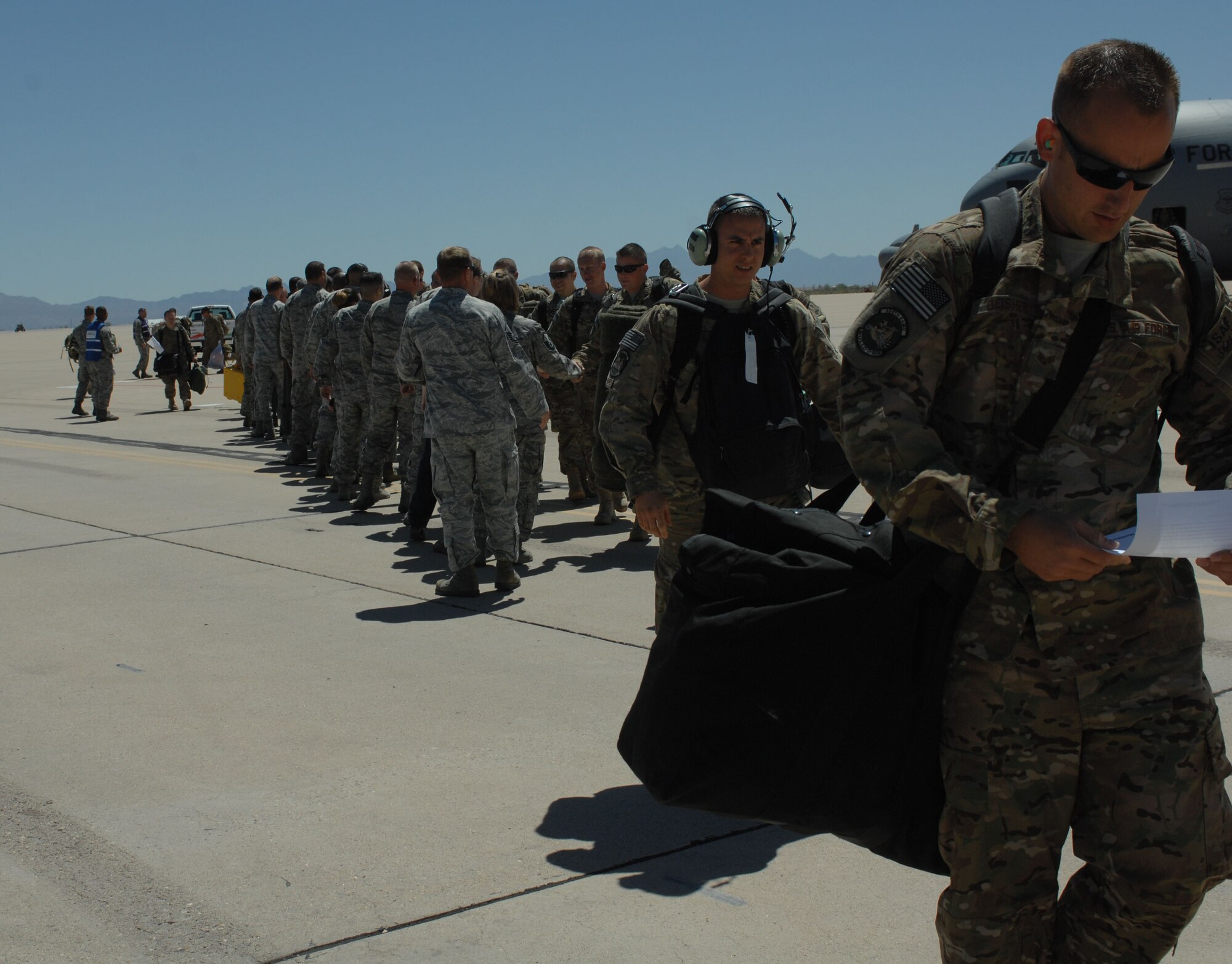 A-10 pilots and aircrew from the 354th Fighter Squadron and 355th Maintenance Group shake hands with Davis-Monthan Air Force Base leadership here, April 11, 2013. The Airman returned after a six-month deployment to Bagram Airfield, Afghanistan. (U.S. Air Force photo by Airman 1st Class Betty R. Chevalier/released)