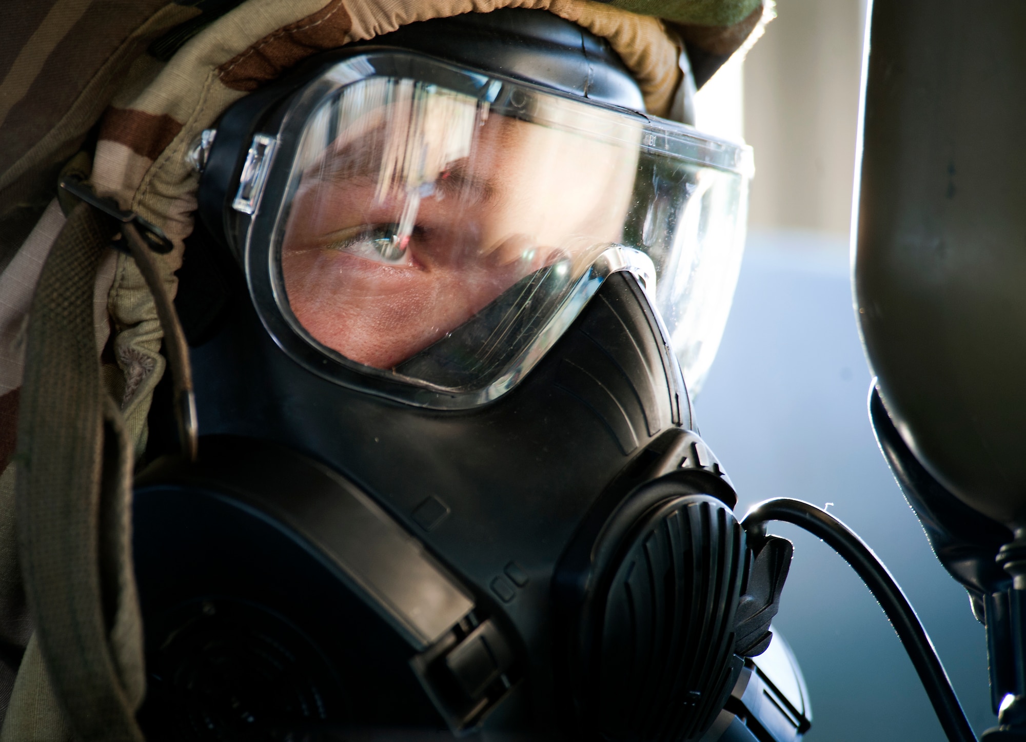 Airman 1st Class Dylan Howell, 7th Logistics Readiness Squadron, drinks from his canteen while wearing an M50 joint-service general purpose mask during an Operational Readiness Exercise April 11, 2013, at Dyess Air Force Base, Texas. An ORE is one of many exercises designed to test a base’s ability to deploy quickly. The first two days of the exercise were conducted as a Phase I exercise and the last two as a Phase II exercise. In Phase II, Airmen traveled to Ray Rangel Air Base, Dyess’ mock deployment location, where Airmen were tested on their ability to function in a deployed environment. While at Ray Rangel, Airmen faced many challenges in the form of injects, which are scenarios that can vary from unexploded ordinances to opposition forces attacking the base. (U.S. Air Force photo by Airman 1st Class Damon Kasberg/ Released)