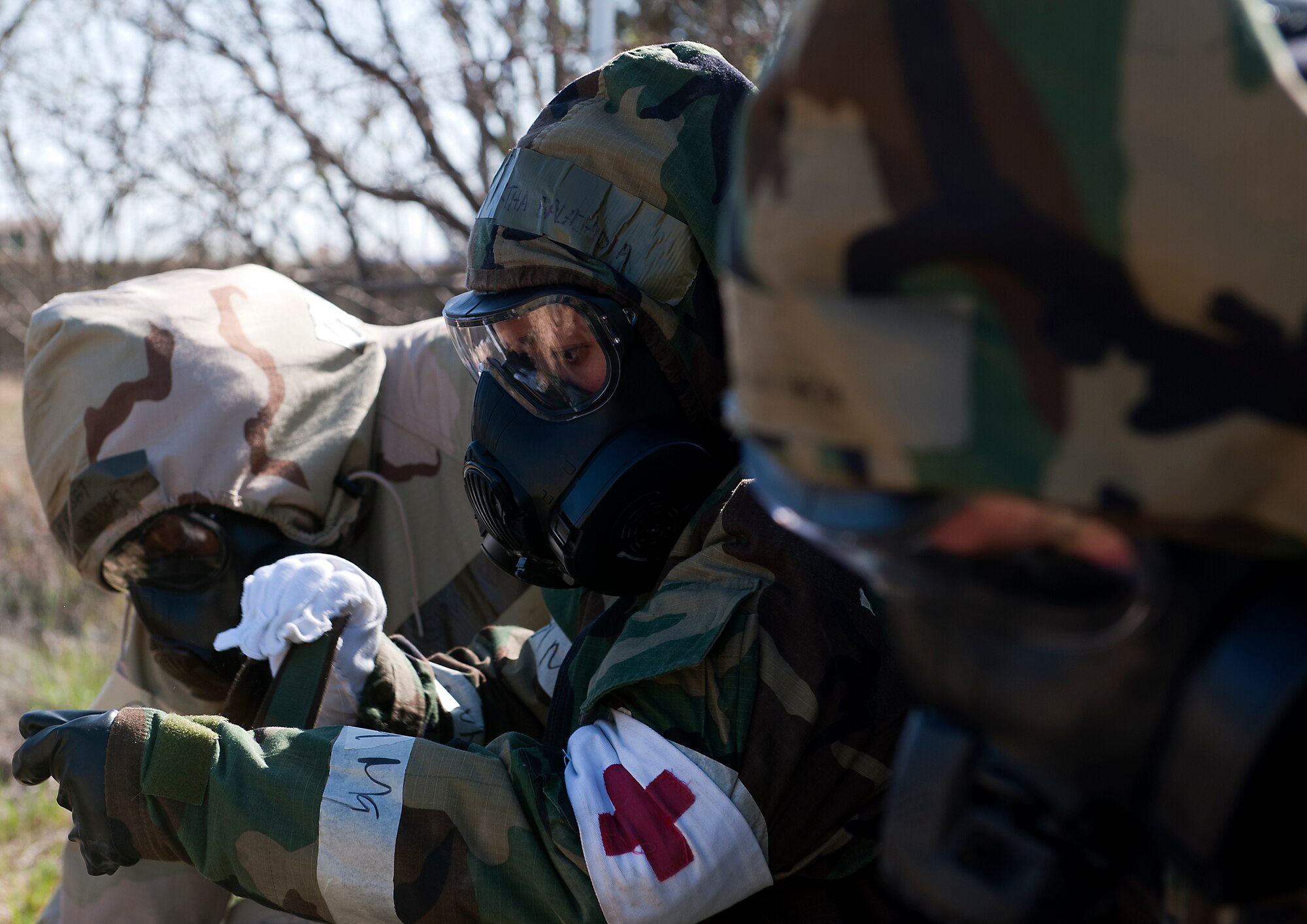 Staff Sgt. Martha Balajadia, 7th Medical Support Squadron, gets into mission oriented protective posture gear during an Operational Readiness Exercise April 11, 2013, at Dyess Air Force Base. An ORE is one of many exercises designed to test a base’s ability to deploy quickly. The first two days of the exercise were conducted as a Phase I exercise and the last two as a Phase II exercise. In Phase II, Airmen traveled to Ray Rangel Air Base, Dyess’ mock deployment location, where Airmen were tested on their ability to function in a deployed environment. While at Ray Rangel, Airmen faced many challenges in the form of injects, which are scenarios that can vary from unexploded ordinances to opposition forces attacking the base. (U.S. Air Force photo by Airman 1st Class Damon Kasberg/ Released)