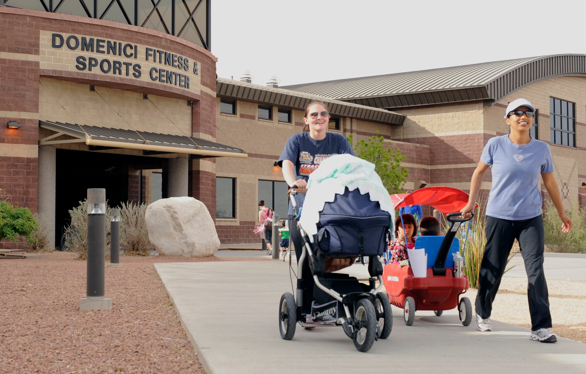 Moms and children start a stroller walk at Holloman Air Force Base, N.M. The walk was part of a new parent support program run by Candi Hutchins, the new parent support nurse here. Her role is to support parents expecting a baby or with children up to 3 years old by making home visits, providing materials, and teaching about parenting. (U.S. Air Force photo by Staff Sgt. Carolyn Herrick/Released)¬
