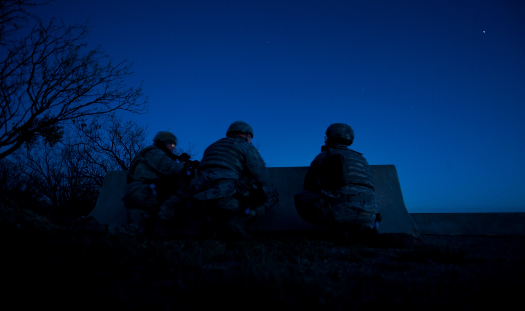 Members of the 7th Security Forces Squadron guard Ray Rangel Air Base during an Operational Readiness Exercise April 10, 2013, at Dyess Air Force Base, Texas. An ORE is one of many exercises designed to test a base’s ability to deploy quickly. The first two days of the exercise were conducted as a Phase I exercise and the last two as a Phase II exercise. In Phase II, Airmen traveled to Ray Rangel Air Base, Dyess’ mock deployment location, where Airmen were tested on their ability to function in a deployed environment. While at Ray Rangel, Airmen faced many challenges in the form of injects, which are scenarios that can vary from unexploded ordinances to opposition forces attacking the base. (U.S. Air Force photo by Airman 1st Class Damon Kasberg/ Released)