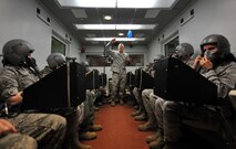 U.S. Air Force Staff Sgt. John Patrick Thorpe, aerospace and operational physiologist technician from Beale Air Force Base, Calif., provides instructions to Airmen prior to their high altitude training test inside a high-altitude chamber April 4 at Offutt Air Force Base, Neb. This was the chamber’s “fini flight” as newer technology has started to replace high-altitude chambers across the Air Force. (U.S. Air Force Photo by Josh Plueger/Released)