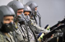 U.S. Air Force Maj. Kristen Nemish, U.S. Strategic Command, sits inside a high-altitude chamber to undergo a series of altitude pressure tests April 4 at the Offutt Air Force Base, Neb.  The altitude tests allow Airmen to experience and learn how to deal with physiological changes that affect the body at high altitudes such as trapped gasses, decompression sickness and hypoxia.  (U.S. Air Force Photo by Josh Plueger/Released)