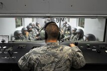 U.S. Air Force Staff Sgt. John Patrick Thorpe, an aerospace and operational physiologist technician from Beale Air Force Base, Calif., provides instructions to Airmen prior to their high altitude training test inside a high-altitude chamber April 4 at Offutt Air Force Base, Neb. This group of Airmen was part of the chamber’s “fini-flight,” which marked the end of more than 50 years the chamber has simulated high altitude conditions for flyers across the U.S. and foreign military. For more than 50 years the chamber has simulated high altitude conditions for to flyers across the U.S. and foreign military giving them a chance to feel the effects of altitude on their bodies such as trapped gasses, decompression sickness and hypoxia.  (U.S. Air Force Photo by Josh Plueger/Released)