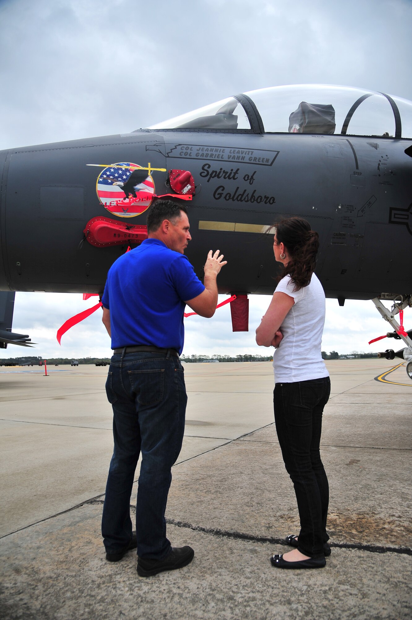 Retired Col. Joe Justice and his spouse, Angela Justice, admire the 4th Fighter Wing flagship during a part of the 25th anniversary celebration of the F-15E Strike Eagle on Seymour Johnson Air Force Base, N.C., April 12, 2013. More than 450 Strike Eagle Airmen and family members are reuniting at Seymour Johnson Air Force Base to commemorate the remarkable history of this combat-proven aircraft. (U.S. Air Force photo by Airman 1st Class Aubrey White/Released) 