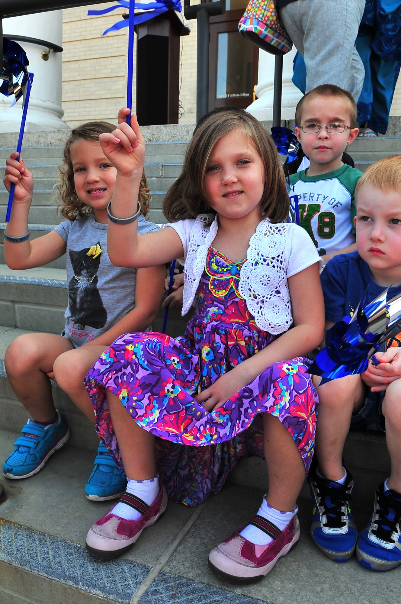 Team Seymour children from the Child Development Center play with their pinwheels after the Child Abuse Prevention Month Proclamation Ceremony at City Hall in Goldsboro, N.C., April 10, 2013. The pinwheel is reflective of the bright future all children deserve and the belief that getting it right early is less costly than trying to fix it later. (U.S. Air Force photo by Airman 1st Class Aubrey White/Released)