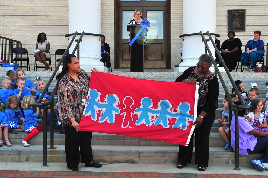 The children’s memorial flag is displayed during the Child Abuse Prevention Month Proclamation Ceremony at City Hall in Goldsboro, N.C., April 10, 2013. The flag honors children who have endured abuse and is used to raise awareness about the continuing problem of violence against children. (U.S. Air Force photo by Airman 1st Class Aubrey White/Released)