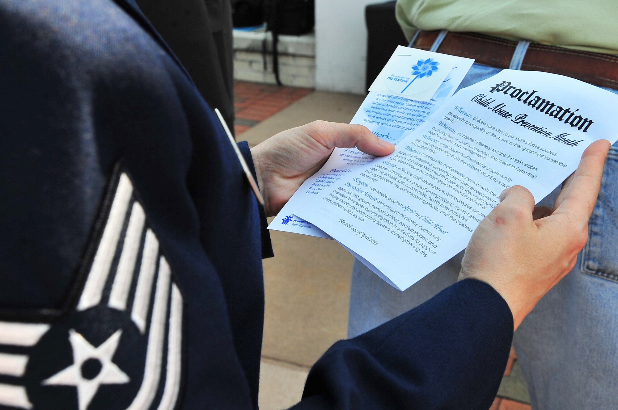 A U.S. Air Force Airman assigned to the 4th Fighter Wing reviews the Child Abuse Prevention Month proclamation during a ceremony at City Hall in Goldsboro, N.C., April 10, 2013. The proclamation states that “children are vital to our state’s future success, prosperity and quality of life as well as being our most vulnerable assets.” (U.S. Air Force photo by Airman 1st Class Aubrey White/Released)