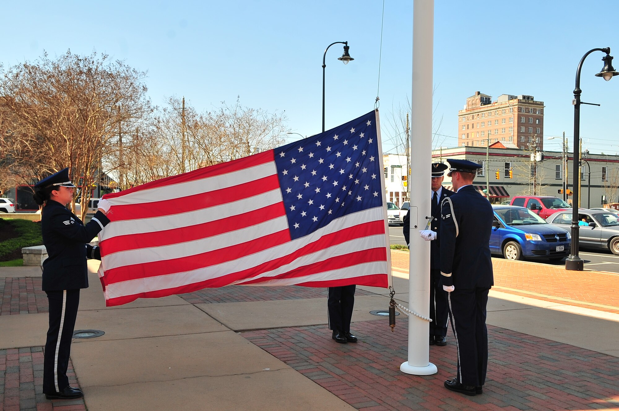 Members of the 4th Fighter Wing Honor Guard raise the American flag, marking the beginning of the Child Abuse Prevention Proclamation Ceremony at City Hall in Goldsboro, N.C., April 10, 2013. The ceremony emphasized the motto, “It Only Takes a Moment” to make a difference in the life of a child. (U.S. Air Force photo by Airman 1st Class Aubrey White/Released)
