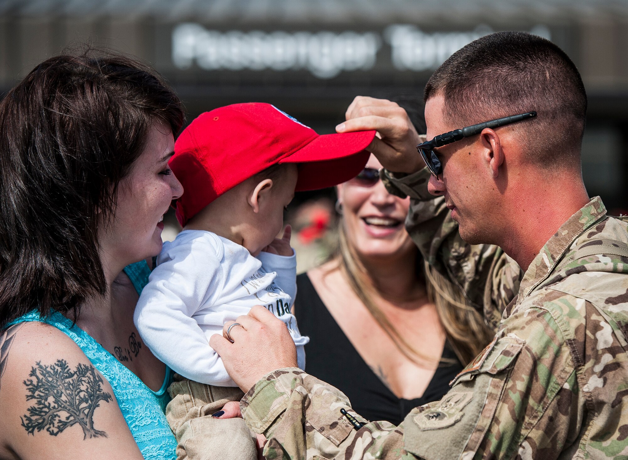 Senior Airman Michael Blankenship, 560th Red Horse Squadron, Embraces his wife Krystal and son Landon after returning from the unit’s first six month deployment April, 11, 2013, at Joint Base Charleston, S.C.  The Air Force Reservists have been deployed as part of the the 557th Expeditionary RED HORSE Squadron since November and were responsible for heavy construction projects at various Middle Eastern locations. (U.S. Air Force photo/ Senior Airman Dennis Sloan)