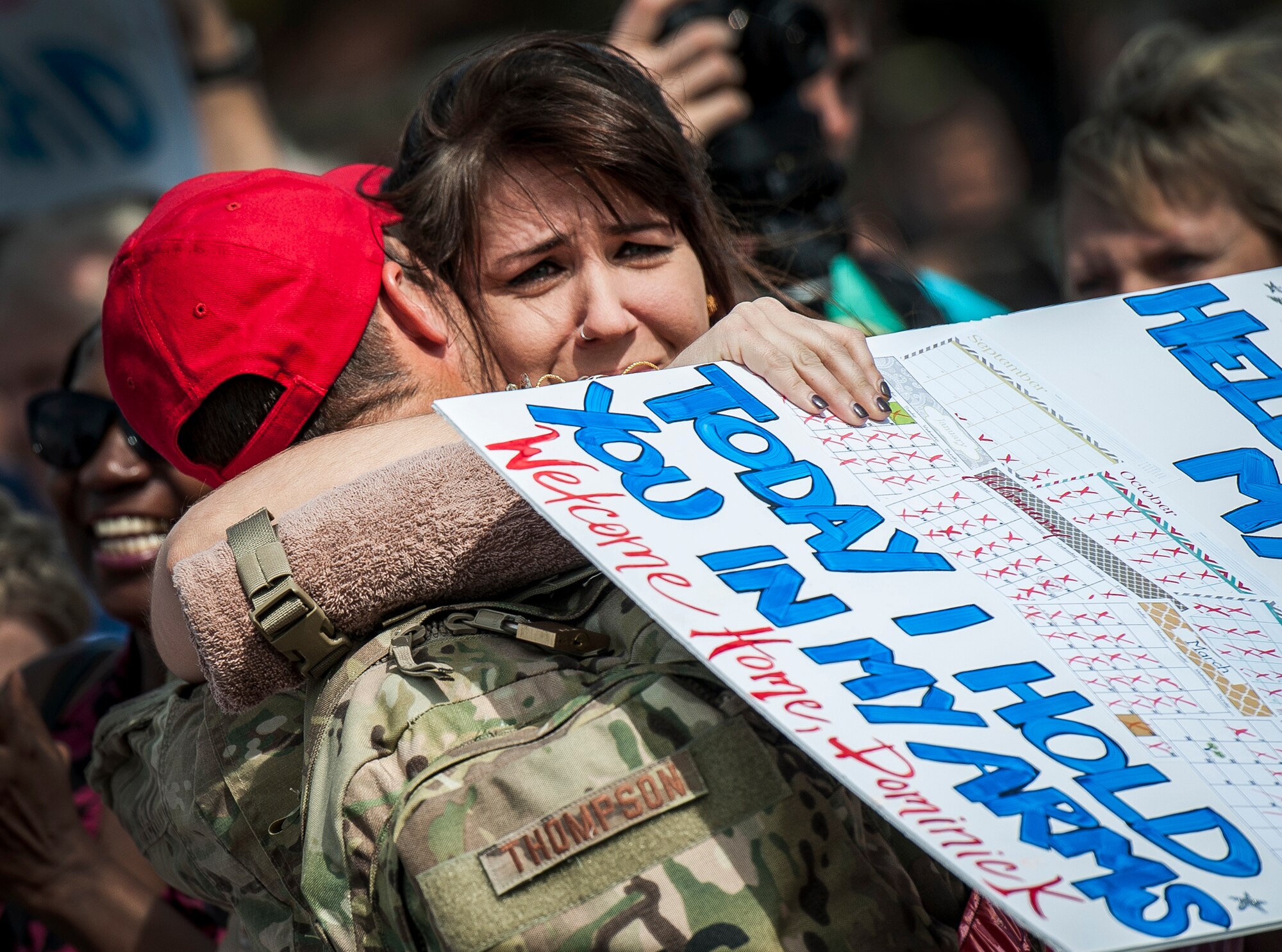 Senior Airman Dominick Thompson, 560th Red Horse Squadron, hugs his wife after returning from the unit’s first six month deployment April, 11, 2013, at Joint Base Charleston, S.C.The Air Force Reservists have been deployed as part of the the 557th Expeditionary RED HORSE Squadron since November and were responsible for heavy construction projects at various Middle Eastern locations.  (U.S. Air Force photo/ Senior Airman Dennis Sloan)
