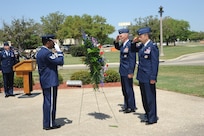 U. S. Air Force Maj. Gen. Timothy Zadalis, Director of Intelligence, Operations, and Nuclear Integration at Headquarters Air Education and Training Command, Col. Gerald Goodfellow, 12th Flying Training Wing commander, and honor guard Tech Sgt. Dejuan Stanley, lay a wreath at the Missing Man Monument April 12 during the 560th Flying Training Squadron's 40th Annual Freedom Flyers’ Reunion at Joint Base San Antonio-Randolph.  The reunion is a celebration of repatriated Vietnam prisoners of war. The 560th Flying Training Squadron gave American pilots, who returned in 1973 from imprisonment in North Vietnam, their “freedom flight” to honor their return.  (U.S. Air Force photo by Melissa Peterson)
