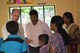 In his civilian job, Lt. Col. Jon Burgess, an individual mobilization augmentee, talks to the Compassion staff and two children about a project in the outlying neighborhoods by Bangalore, India in April 2012. Burgess is a marketing director for Compassion International. As an IMA, Burgess is assigned to the U.S. Air Force Academy, Colorado Springs, Colo. (Courtesy photo)