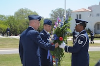 U. S. Air Force Maj. Gen. Timothy Zadalis, Director of Intelligence, Operations, and Nuclear Integration at Headquarters Air Education and Training Command, Col. Gerald Goodfellow, 12th Flying Training Wing commander, and honor guard Tech. Sgt. Dejuan Stanley lay a wreath at the Missing Man Monument April 12 during the 560th Flying Training Squadron's 40th Annual Freedom Flyers? Reunion at Joint Base San Antonio-Randolph.  The reunion is a celebration of repatriated Vietnam prisoners of war. The 560th Flying Training Squadron gave American pilots, who returned in 1973 from imprisonment in North Vietnam, their ?freedom flight? to honor their return.  (U.S. Air Force photo by Joel Martinez)