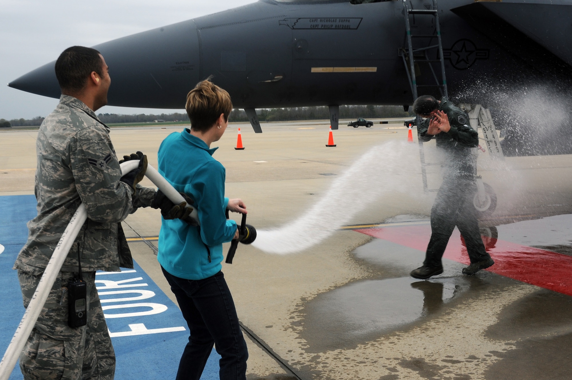 U.S. Air Force Col. Vann Green, 4th Fighter Wing vice commander, gets showered by his spouse, Jan Green, after his final flight on Seymour Johnson Air Force Base, N.C., April 4, 2013. Green has been serving as the 4th FW CV since May 2011 and will depart to become the Chief of Strategic Studies Group for the Chief of Staff of the Air Force. (U.S. Air Force photo by Airman 1st Class John Nieves Camacho/Released)