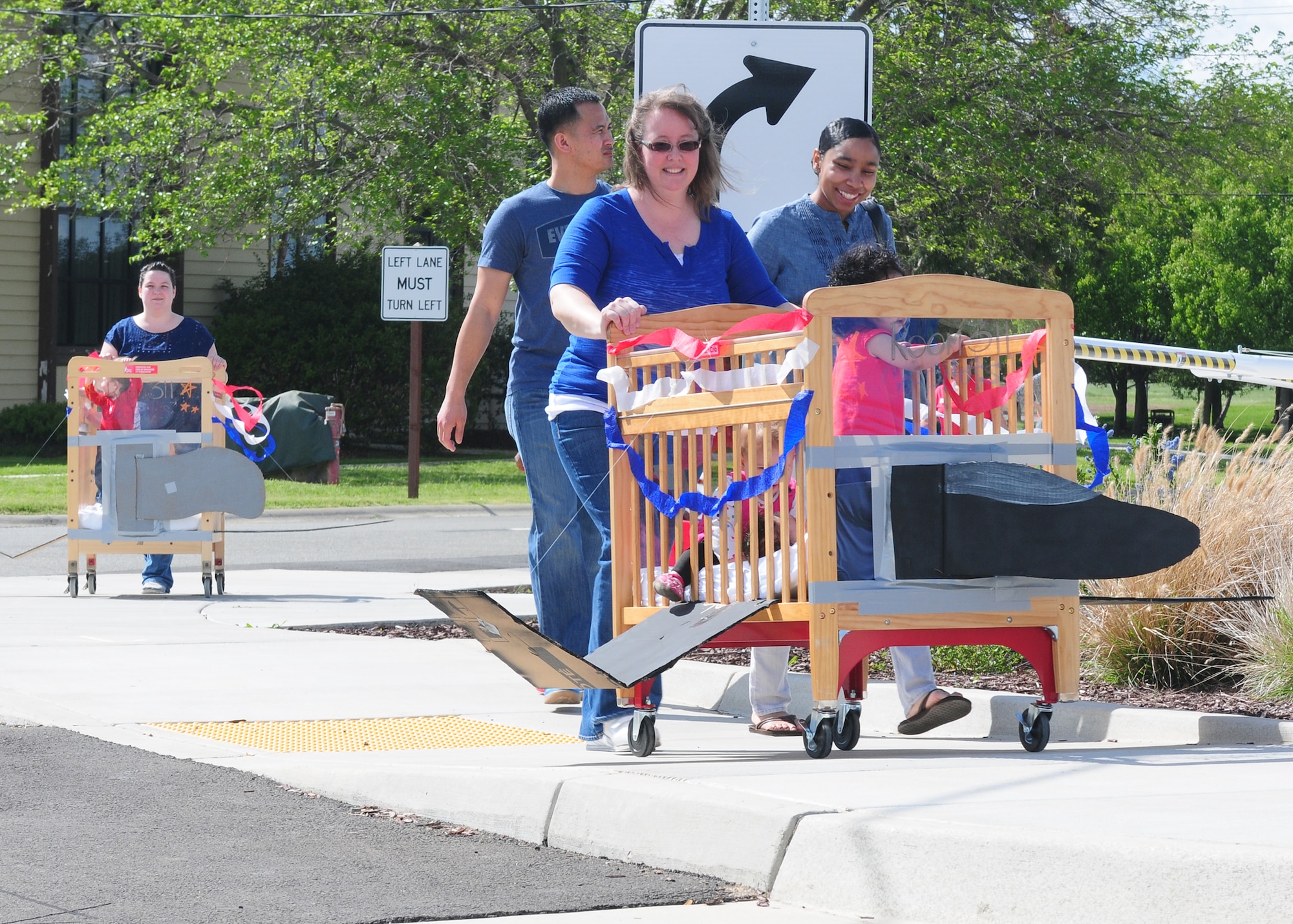 The youngest members of Team Beale fly their cribs through the parade hosted by Child Development Center at Beale Air Force Base Calif., April 5, 2013. April is the month of the military child and the CDC celebrated with a parade for the children. (U.S. Air Force photo by Senior Airman Allen Pollard/Released)