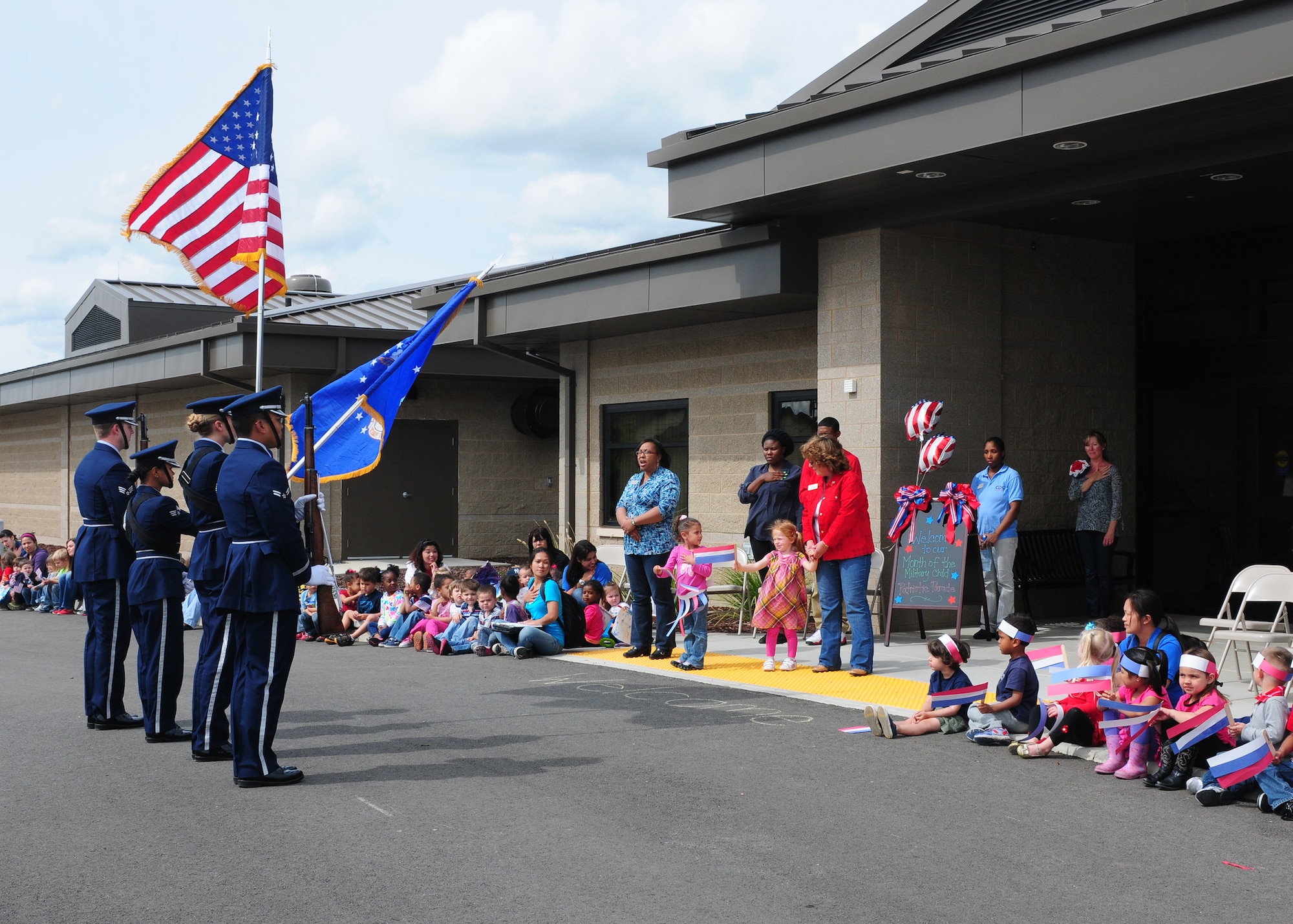 Team Beale's Honor Guard presents the colors to children at the Child Development Center at Beale Air Force Base Calif., April 5, 2013. April celebrates the month of the military child. (U.S. Air Force photo by Senior Airman Allen Pollard/Released)