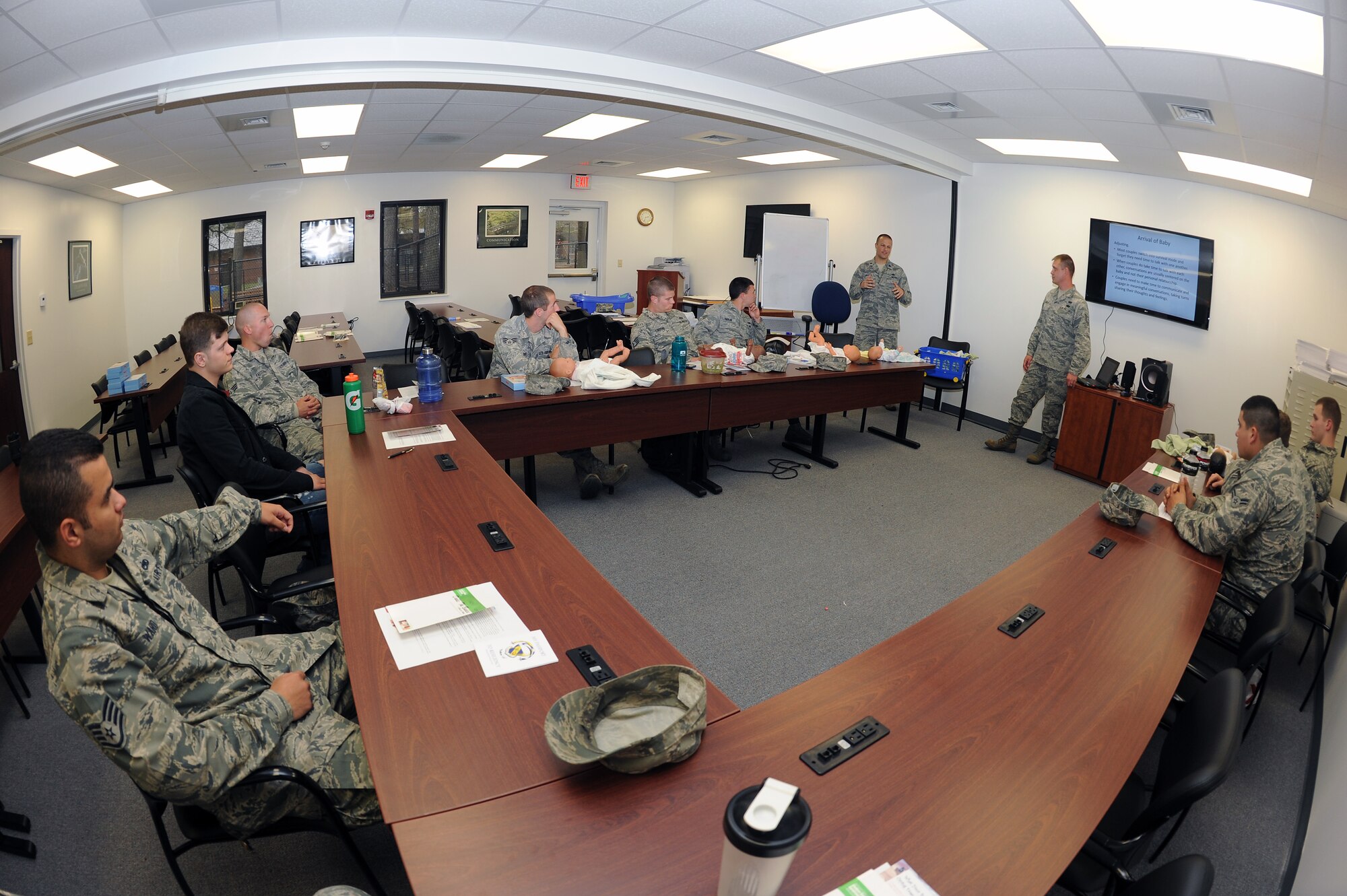U.S Air Force Airmen assigned to the 4th Fighter Wing discuss parenting tips during Dads: The Basics 101 at the Family Life Center on Seymour Johnson Air Force Base, N.C., April 4, 2013. The class discussed numerous topics including communication, childbirth and parenthood in order to increase relationship stability between military members and their spouses. (U.S. Air Force photo by Airman 1st Class John Nieves Camacho/Released)