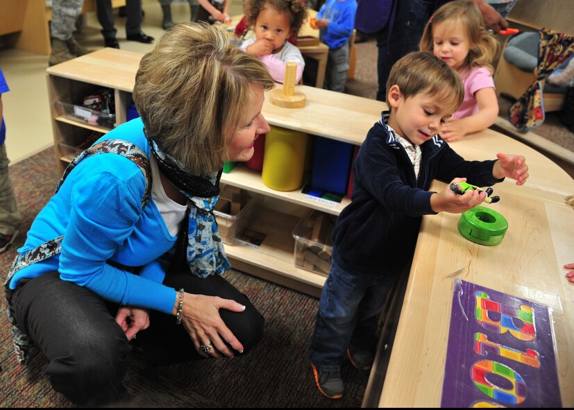 Tami Henderson, 27th Special Operations Wing spouse, talks to a child at the Child Development Center as part of the 27th Special Operations Mission Support Group Honorary Commander’s tour at Cannon Air Force Base, N.M., April 11, 2013. The 27 SOW Honorary Command Program is geared toward fostering military pride and local support from a broad group of surrounding community ambassadors. (U.S. Air Force photo/Senior Airman Alexxis Pons Abascal) 
