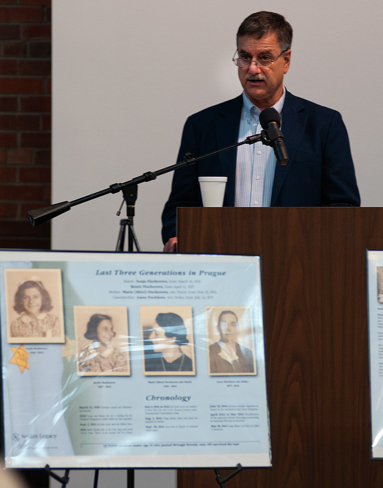 Dave Lerner addresses the audience during the F. E. Warren Air Force Base Holocaust remembrance event in the Fall Hall Community Center April 8. Lerner told the gathering about members of his family who were killed by the Nazis in concentration camps. His presentation included pictures of his relatives and artwork created by a young cousin. (U.S. Air Force photo by R.J. Oriez)