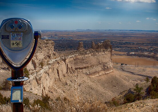 Chimney Rock can be seen on the horizon with the town of Gering, Neb.  in the foreground from the summit of Scotts Bluff National Monument. (U.S. Air Force photo by Matt Bilden)