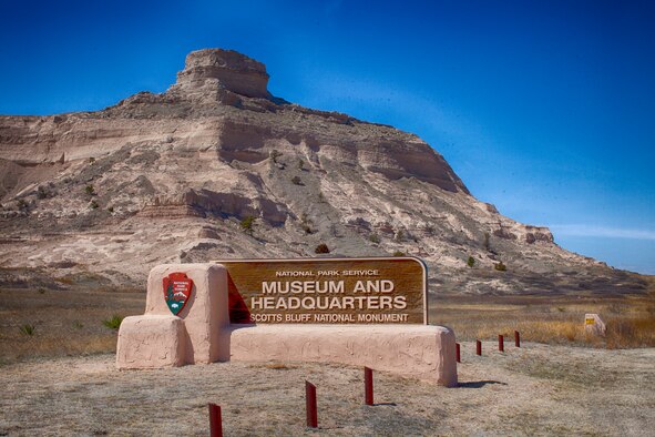 The sign for the Scotts Bluff National Monument museum and headquarters stands along Highway 92 in front of Sentinel Rock  at Scotts Bluff, Neb. (U.S. Air Force photo by Matt Bilden)