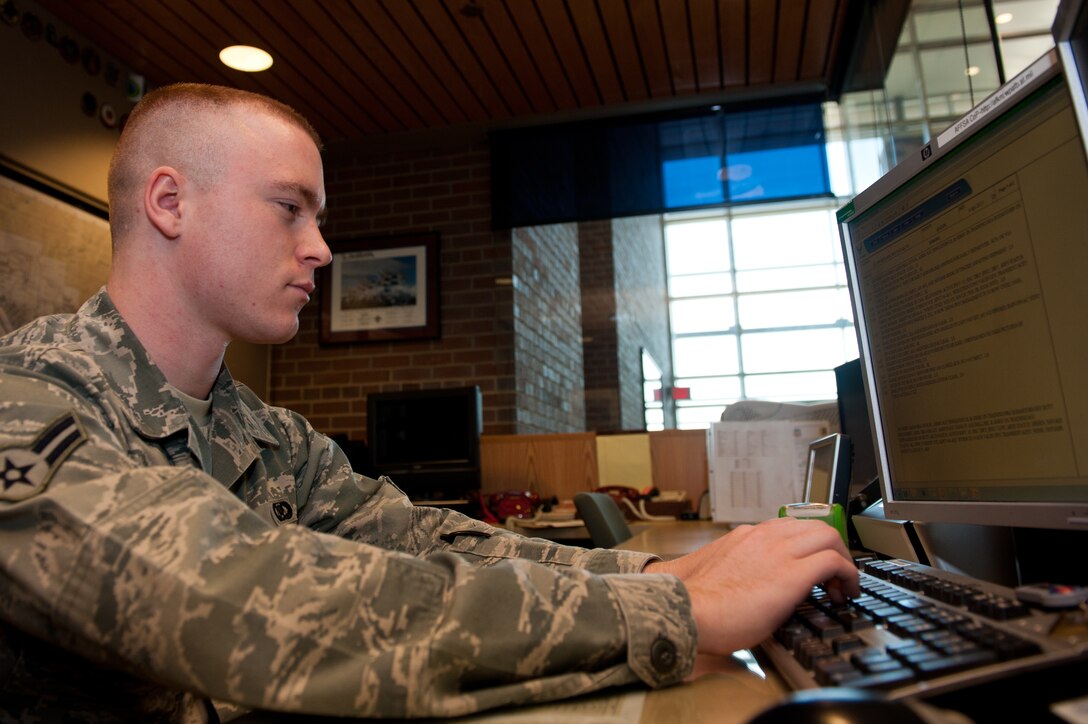 Airman 1st Class Steven Singleton, 28th Operation Support Squadron airfield management specialist, inputs information into an Air Force form 3616, daily log, during his daily duties at Airfield Management on Ellsworth Air Force Base, S.D., April 4, 2013. The daily events log must provide detailed information during shift-changes providing continuity and efficiency. (U.S. Air Force photo by Airman 1st Class Kate Thornton-Maurer/Released) 
