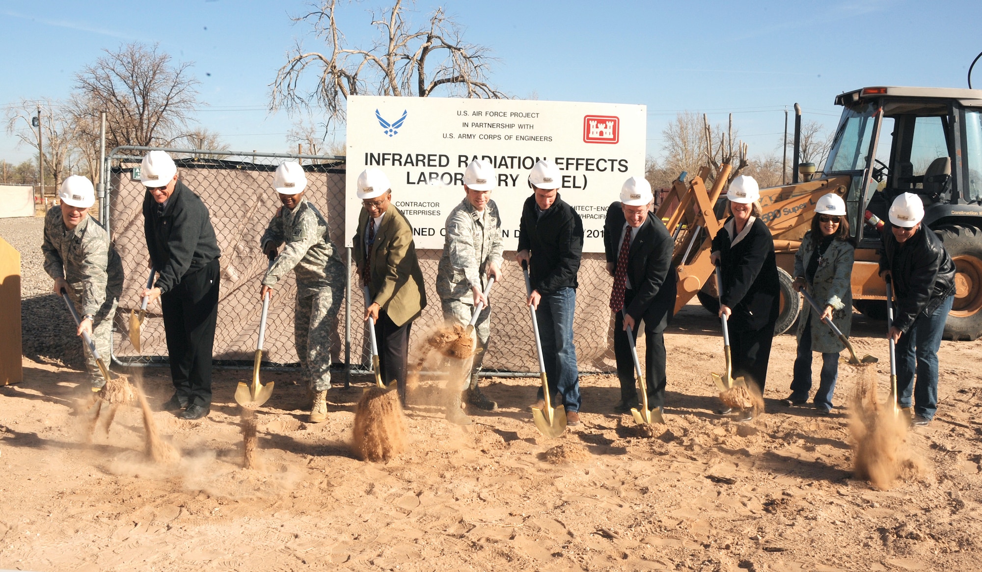 Air Force Research laboratory officials at Kirtland AFB broke ground March 26 on the base’s west side for the Infrared Radiation Effects Laboratory. From left, Col. Bill Cooley, AFRL Space Vehicles director; Dr. Jim Riker, AFRL Space Vehicles chief scientist; Lt. Col. Antoinette Gant, commander, Army Corps of Engineers Albuquerque District; Dr. B.K. “Babu” Singaraju, AFRL Space Technology division chief; Capt. Dustin Guidry, AFRL Space Based Advanced Sensing and Protection deputy branch chief; Dr. Vincent Cowan , AFRL scientist; Brent Wilson, Kirtland AFB civil engineer;  Susan Atwood, AFRL Space Vehicles deputy director;  Maria Cornay, president, GranCor Construction; and Mike Grandjean, executive vice president, GranCor Construction. (Photo by Dennis Carlson)